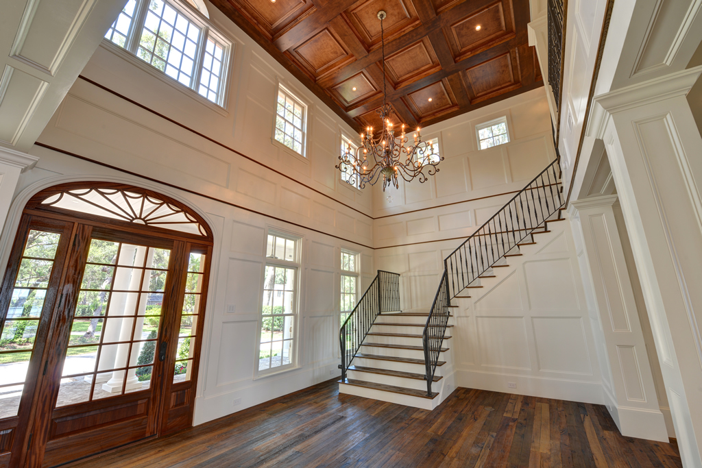 Inside entrance to home with wood floors and staircase