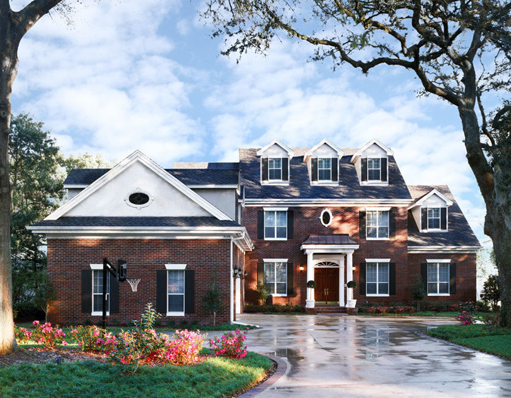 Brick house with wooden French front doors