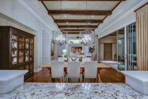 Large dining room with white and wooden accents